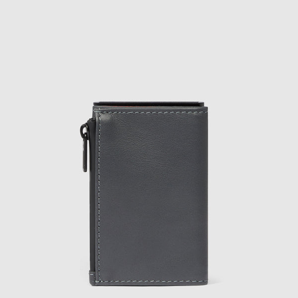 Compact wallet with sliding system and coin pocket