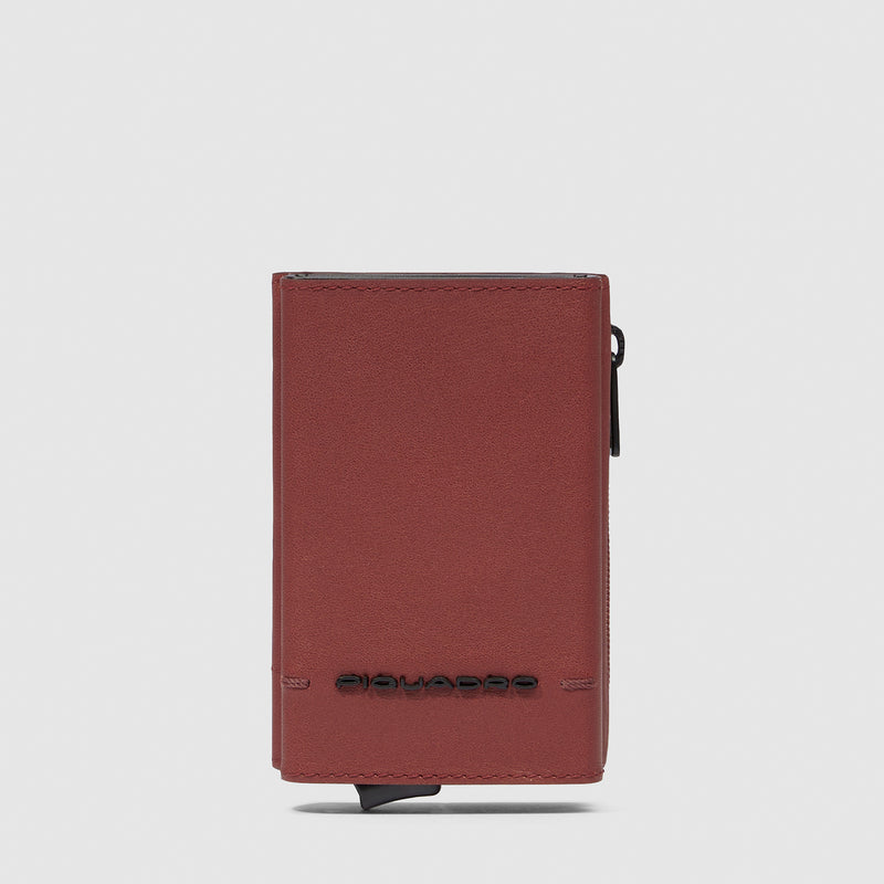 Compact wallet with sliding system and coin pocket