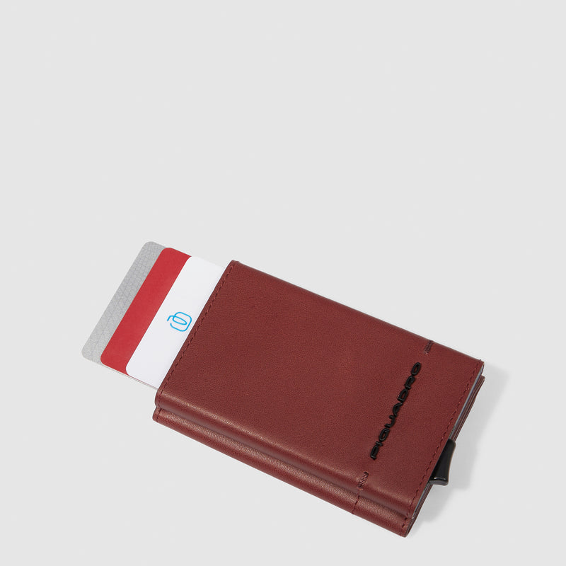 Compact wallet with sliding system and coin pocket